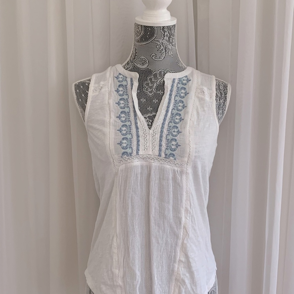 white top with blue detailing